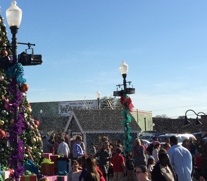 fake snow machine attached to lamposts 